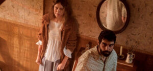 Carla Juri and Alec Secareanu in AMULET